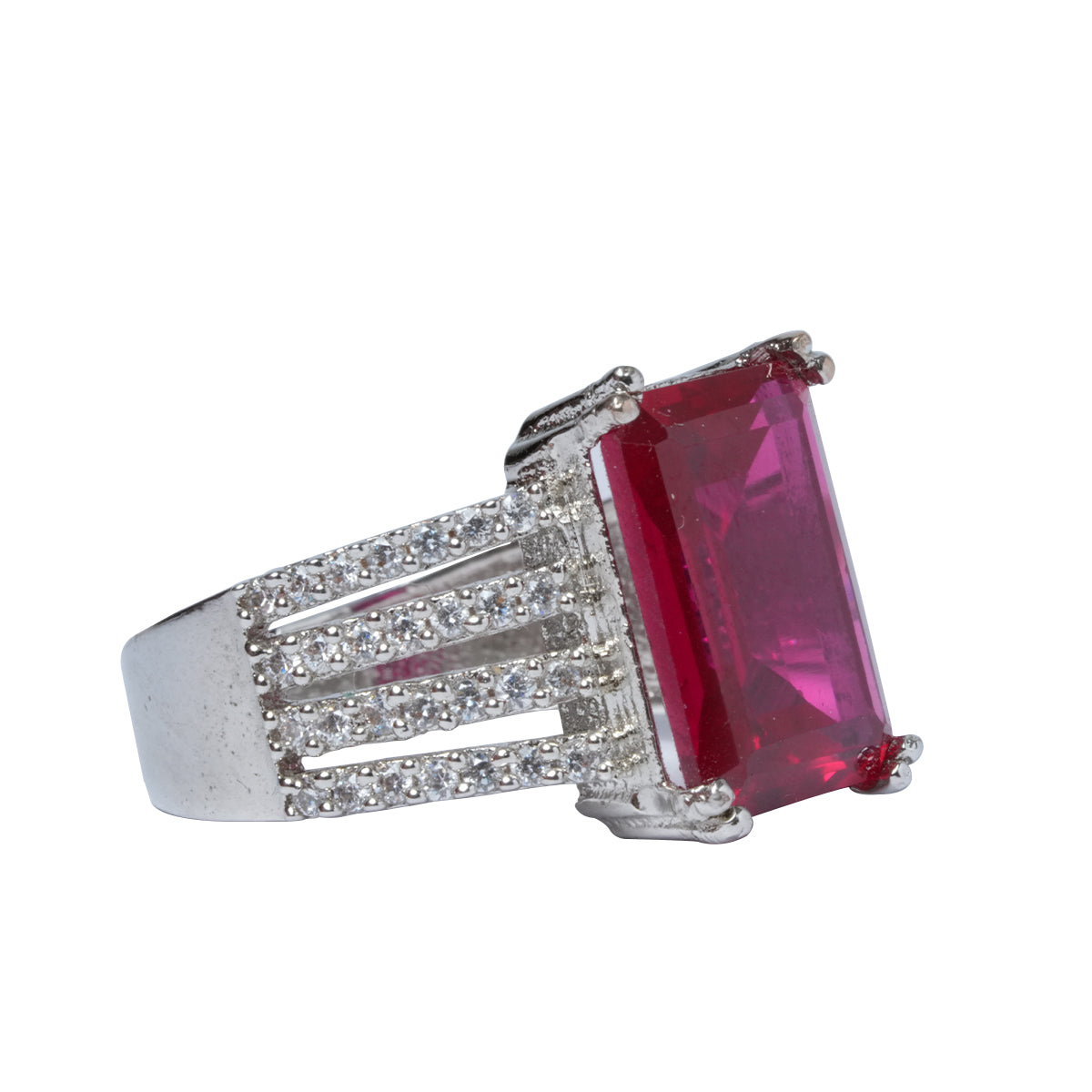 Angled close-up showing ruby and CZ stones on ring