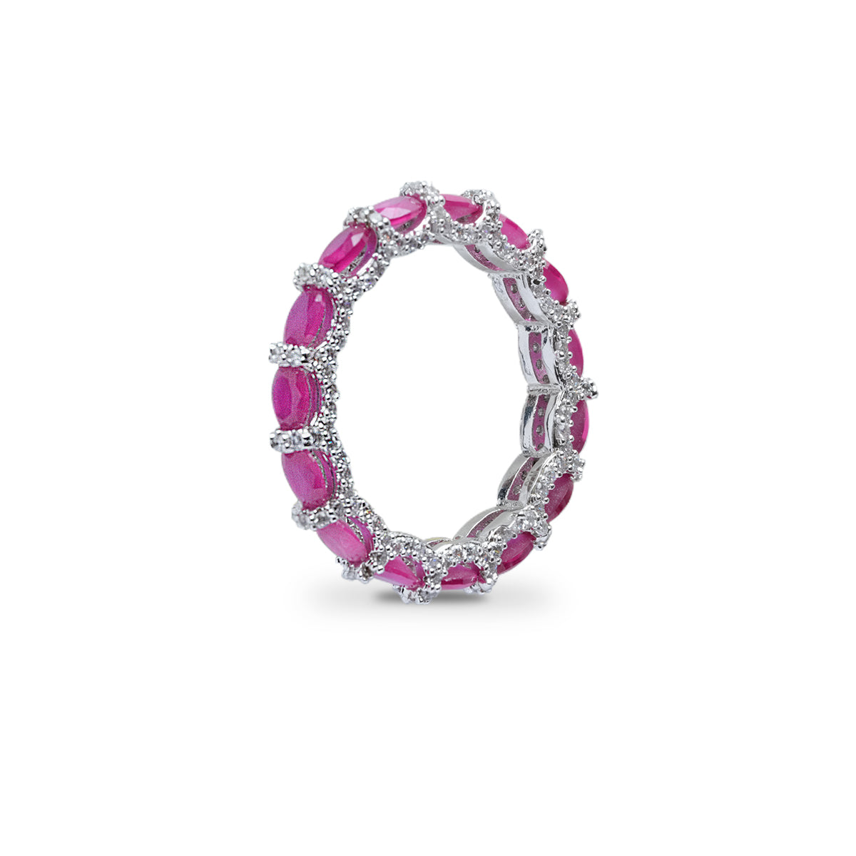 Angled view of pink and ruby band ring showing all-stone circle design