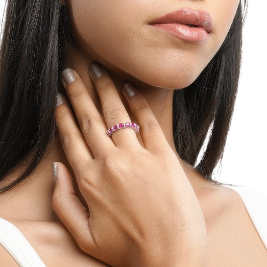 Close-up of pink ring worn on finger in elegant hand pose