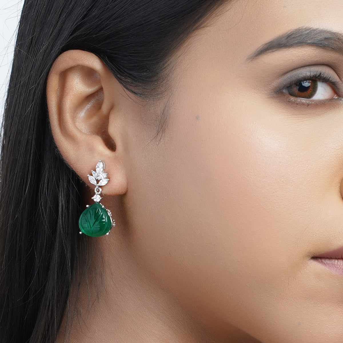 Model close-up wearing one green CZ drop earring