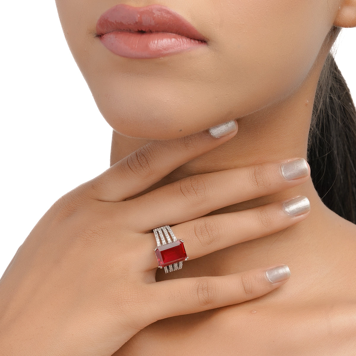 Model hand pose wearing ruby and CZ stone ring