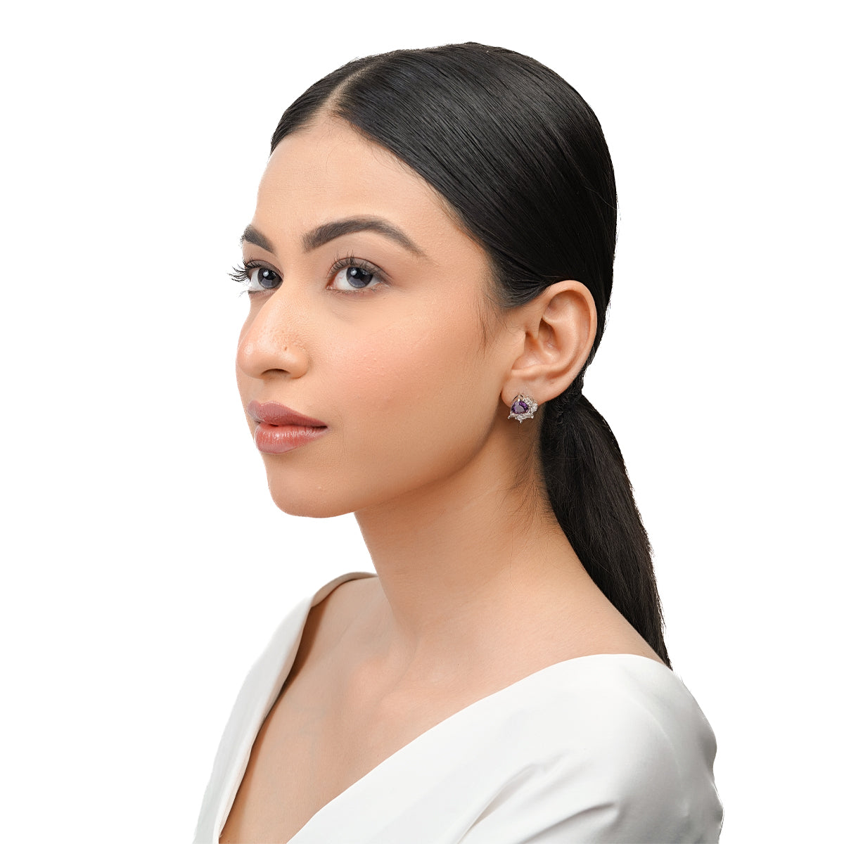 Side profile of model wearing purple amethyst CZ stud earrings
