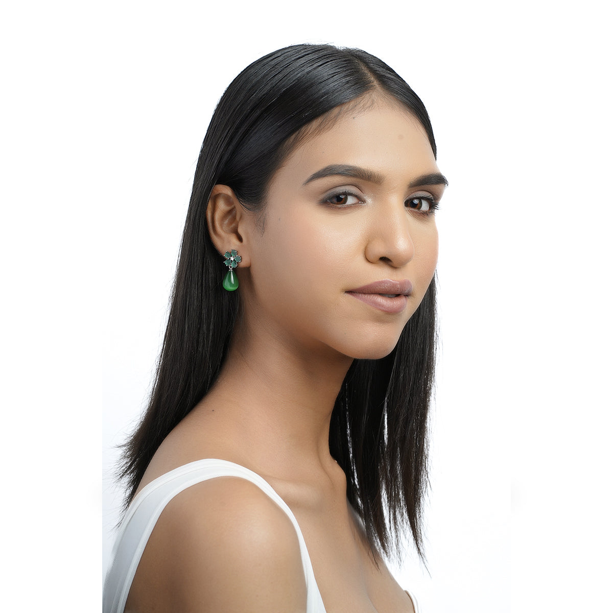 Model wearing green floral CZ earrings front pose