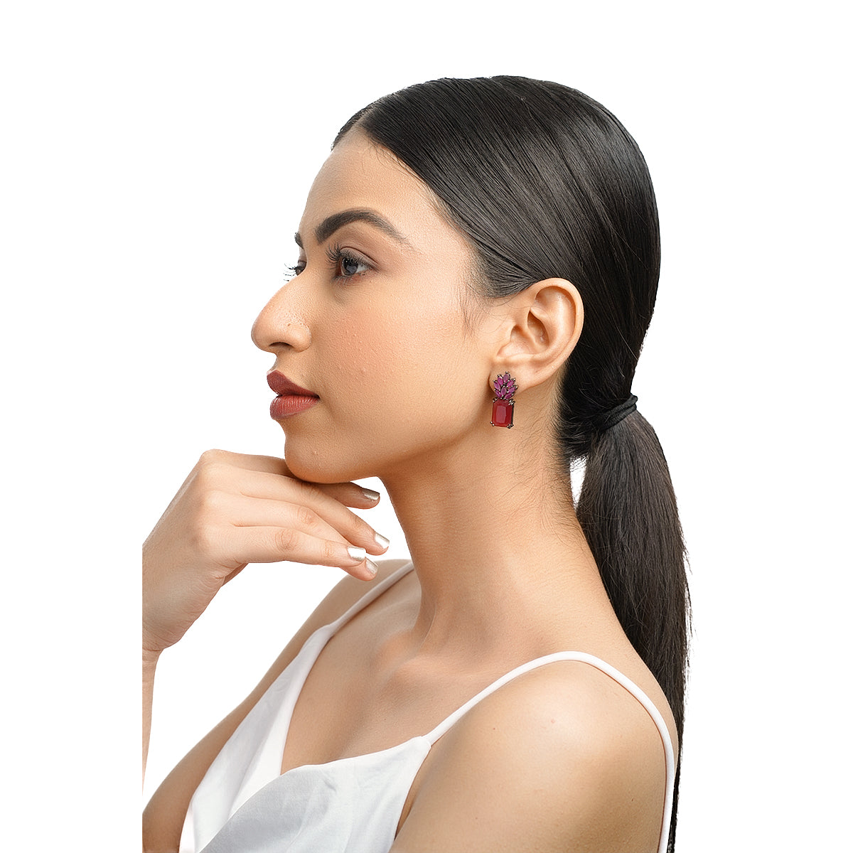 Side profile of model wearing ruby and pink gemstone earrings