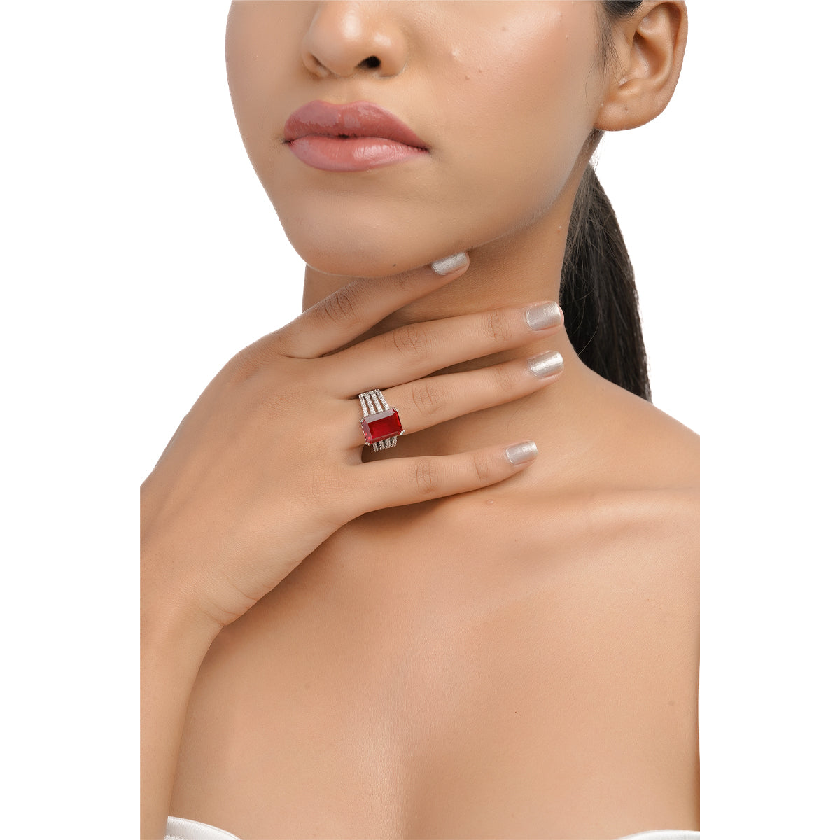 Model wearing ruby statement ring on hand