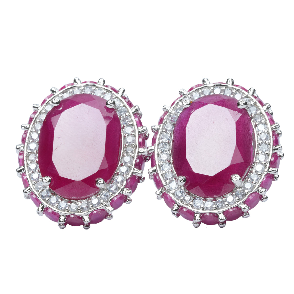 Pink ruby studs displayed from a flat side angle