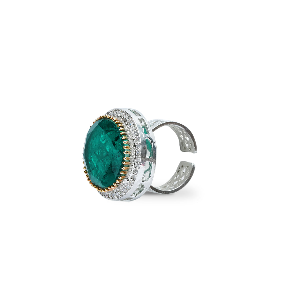 Side view of green statement ring with wide band and raised design