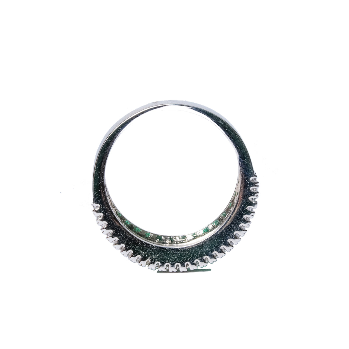 Top view of green and white baguette CZ ring showing circular band