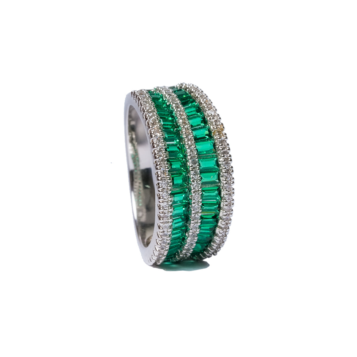 Angled vertical view of green CZ ring with triple band design