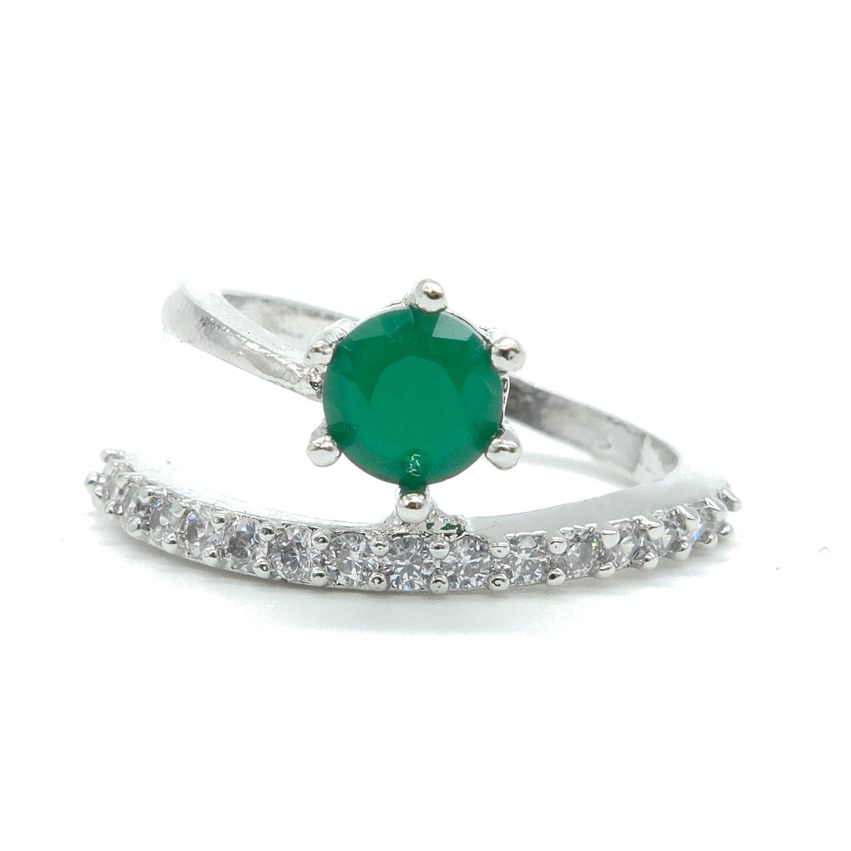 A silver ring featuring a round green emerald-cut center stone and a curved pavé band set with small clear stones, shown on a plain white background.