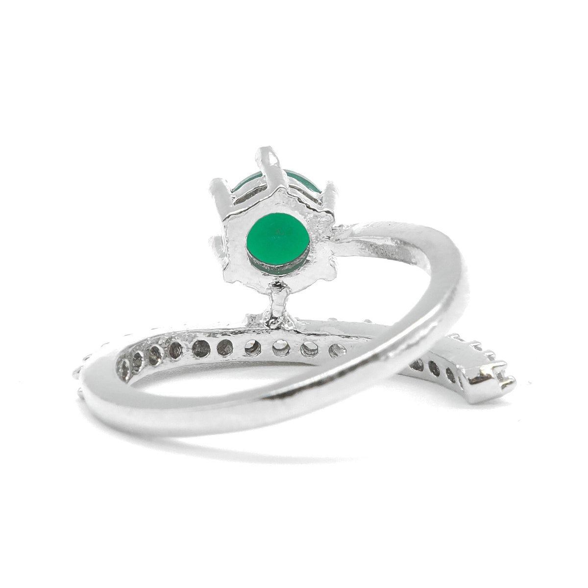 A silver ring featuring a round green emerald-cut gemstone in a crown-like setting, with a curved band accented by small pavé-set stones, shown on a white background.