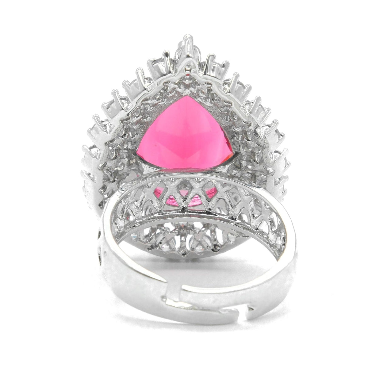 A silver-toned ring featuring a large, faceted pink triangular gemstone at the center, surrounded by smaller pink and clear stones in an intricate crown-like setting, with a polished silver band below.