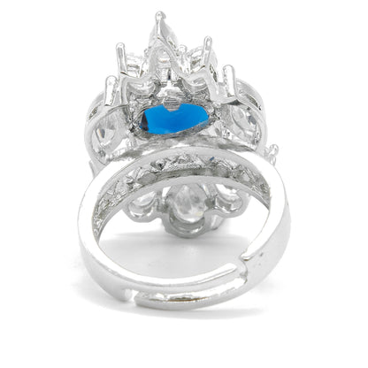 A silver-toned ring with a central blue marquise-cut gemstone and clear accent stones, shown on a plain white background.
