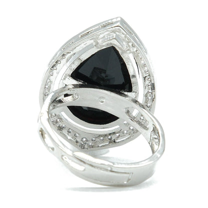A silver-toned ring featuring a large triangular black gemstone in a marquise-cut setting, surrounded by smaller clear stones, on a plain white background.