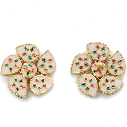 A pair of gold-plated floral stud earrings with white enamel petals and small red and green floral accents, displayed on a clean white background.