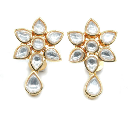 A pair of gold-plated floral earrings featuring clear teardrop-shaped and round stones, arranged symmetrically on a plain white background.