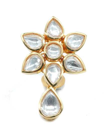 A gold-plated Kundan flower-shaped earring featuring clear teardrop-shaped glass stones, set against a plain white background.