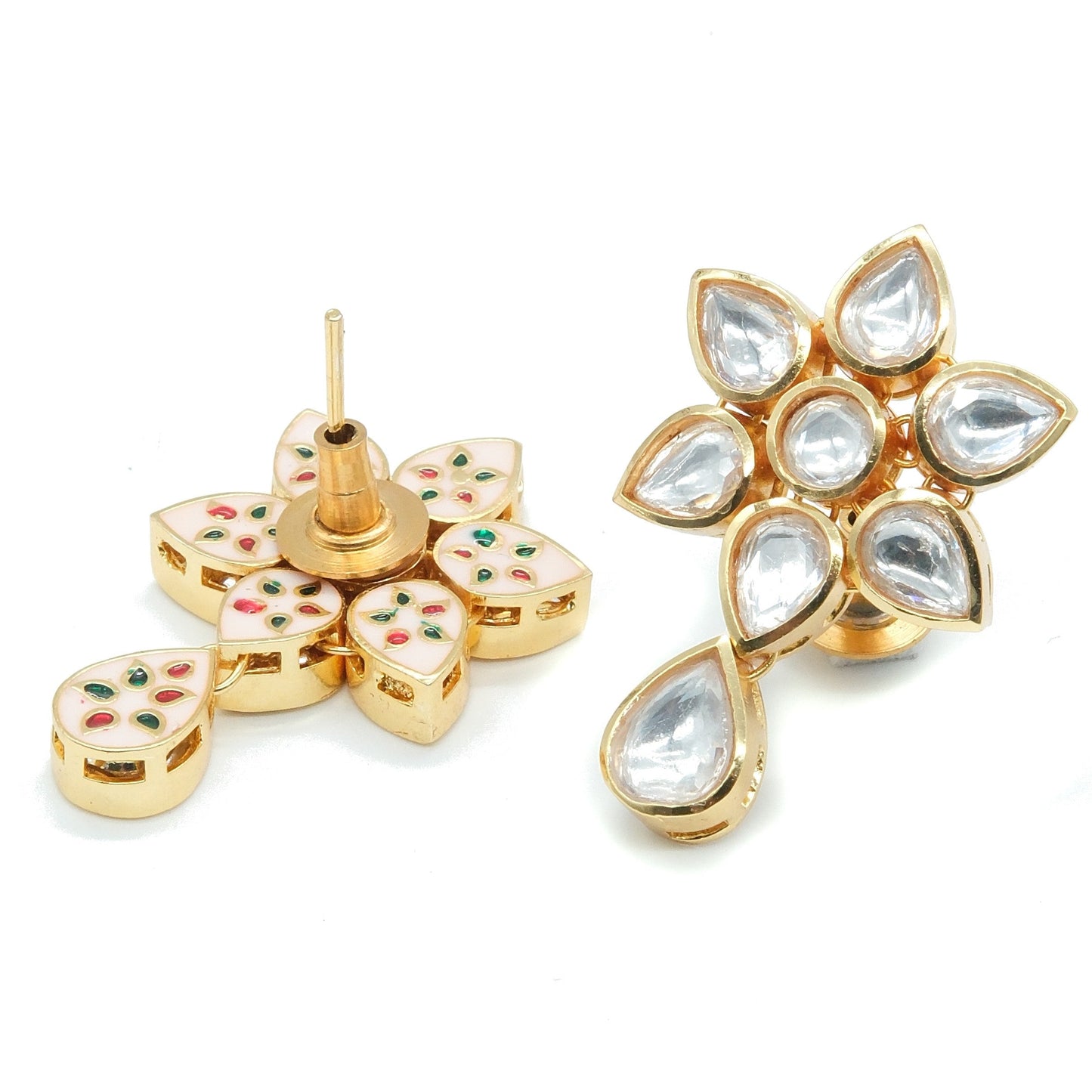 A pair of gold-plated Kundan earrings shaped like flowers, featuring clear teardrop-shaped kundan stones and one earring showing the back with white enamel, red and green stone accents, on a plain white background.