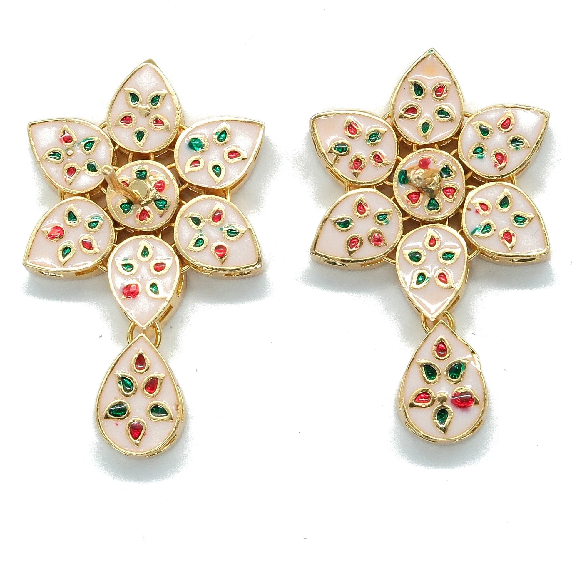 A pair of gold-plated floral statement earrings with white enamel inlay and small red and green stone accents, displayed on a clean white background.