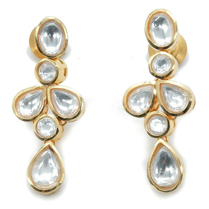 A pair of gold-plated drop earrings featuring clear teardrop-shaped and oval inlay stones, arranged symmetrically on a plain white background.