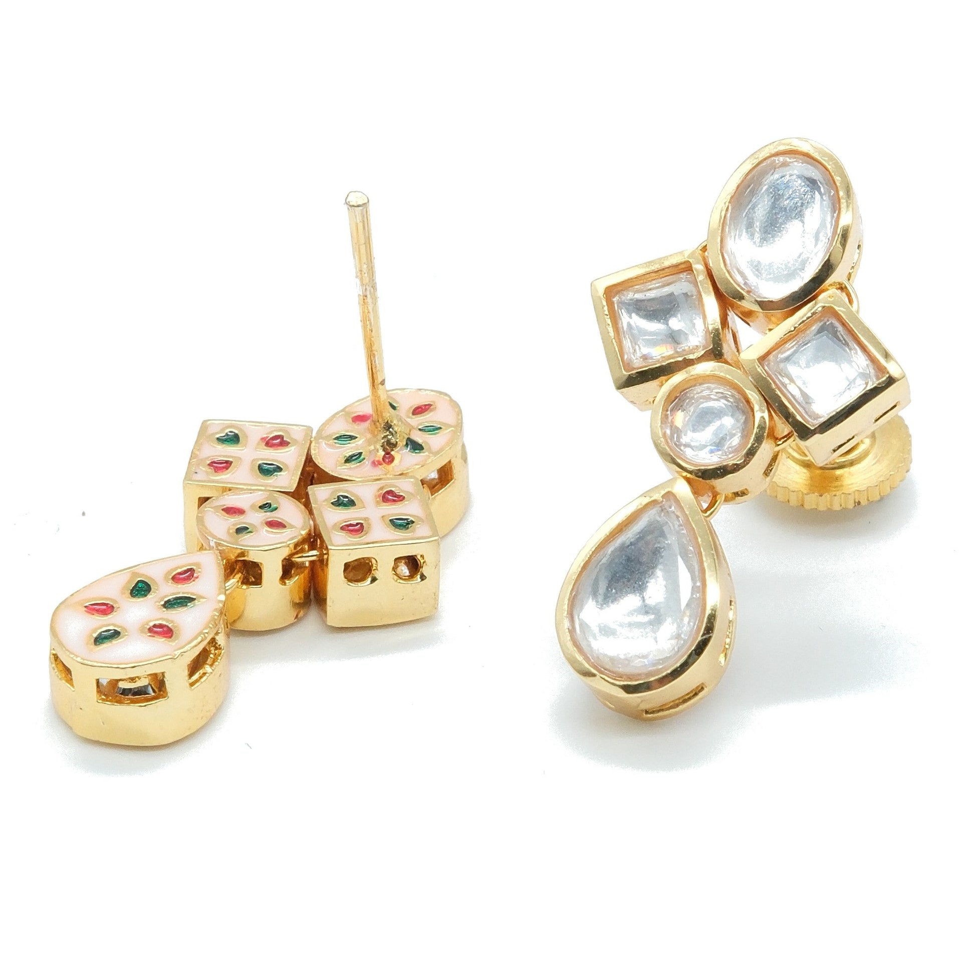 Gold-plated kundan earrings with clear teardrop and square stones, accented with small red and green enamel dots, shown on a white background.