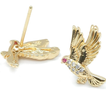 A pair of gold bird stud earrings on a white background, with one earring showing the back and the other showing the front decorated with a small pink gemstone and clear stones.
