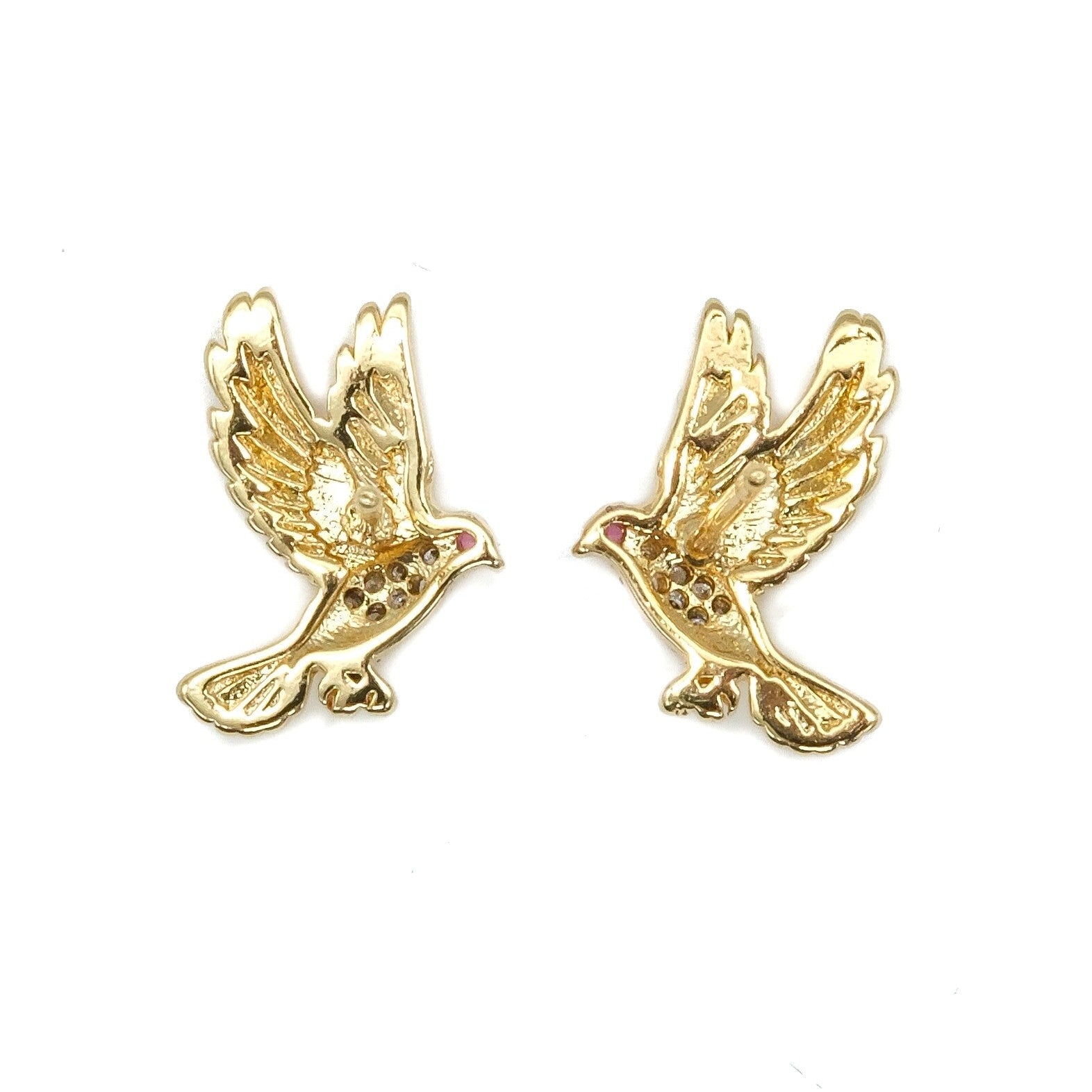 A pair of gold-toned bird stud earrings with small red gemstone accents in the eyes, shown on a plain white background.