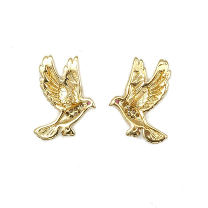 A pair of gold-toned bird stud earrings with small red gemstone accents in the eyes, shown on a plain white background.