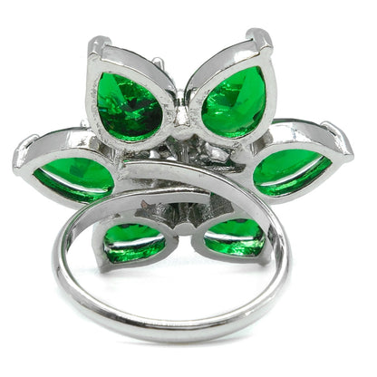 A silver butterfly ring featuring vibrant green teardrop-shaped gemstones, photographed on a clean white background.