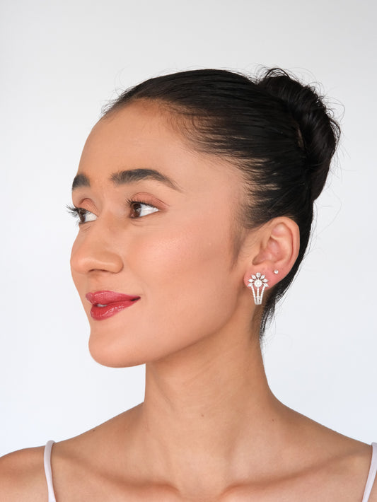 Elegant model in a side pose wearing Floral American Diamond Drop Earrings, showcasing sparkling floral design earrings for women.