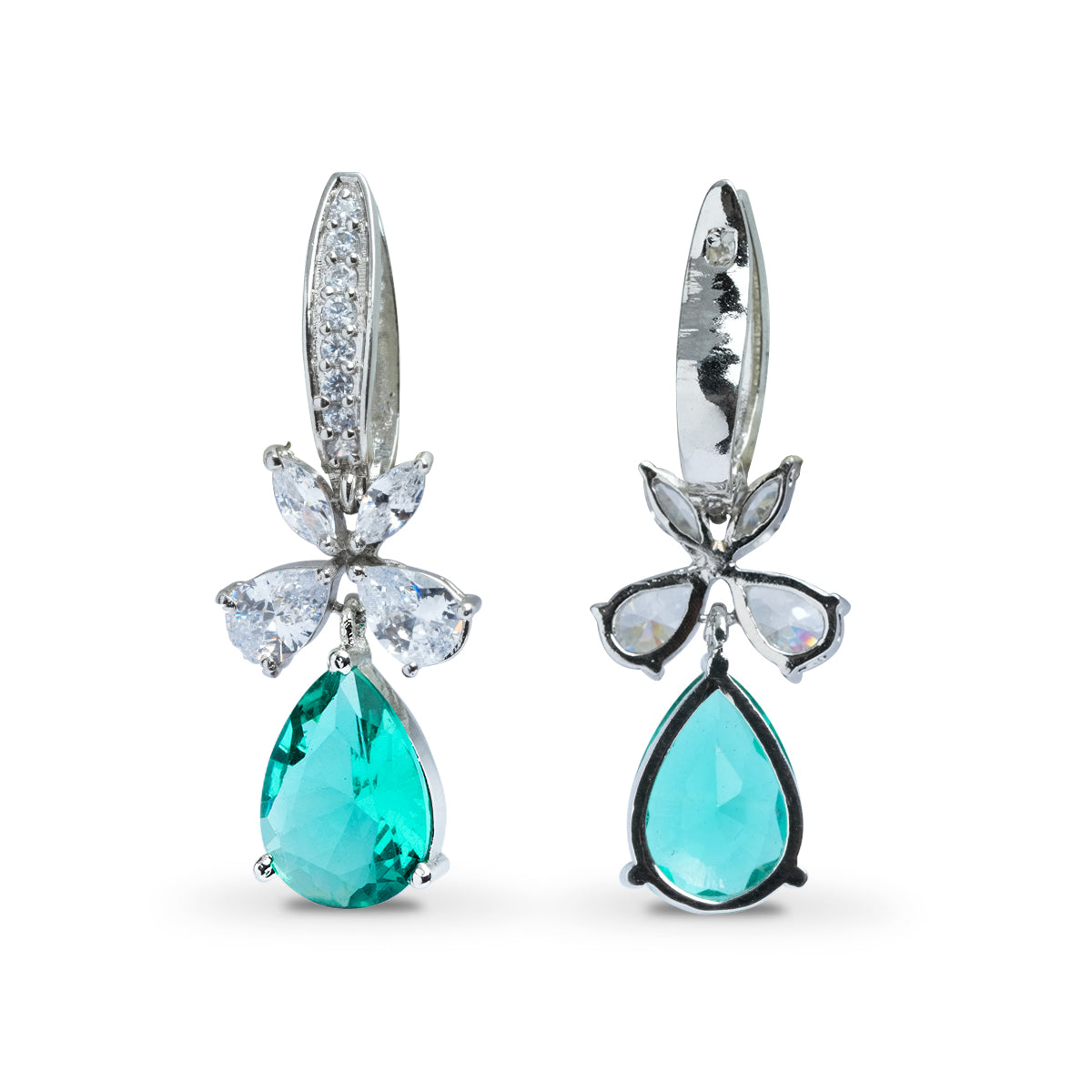 Angled view of teal dangle earrings with shiny stones