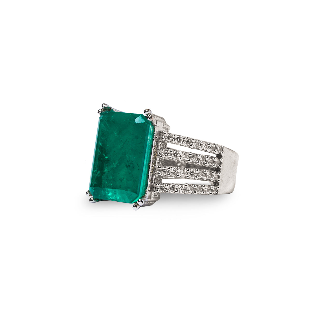 Angled view of green rectangle ring with clear side stones