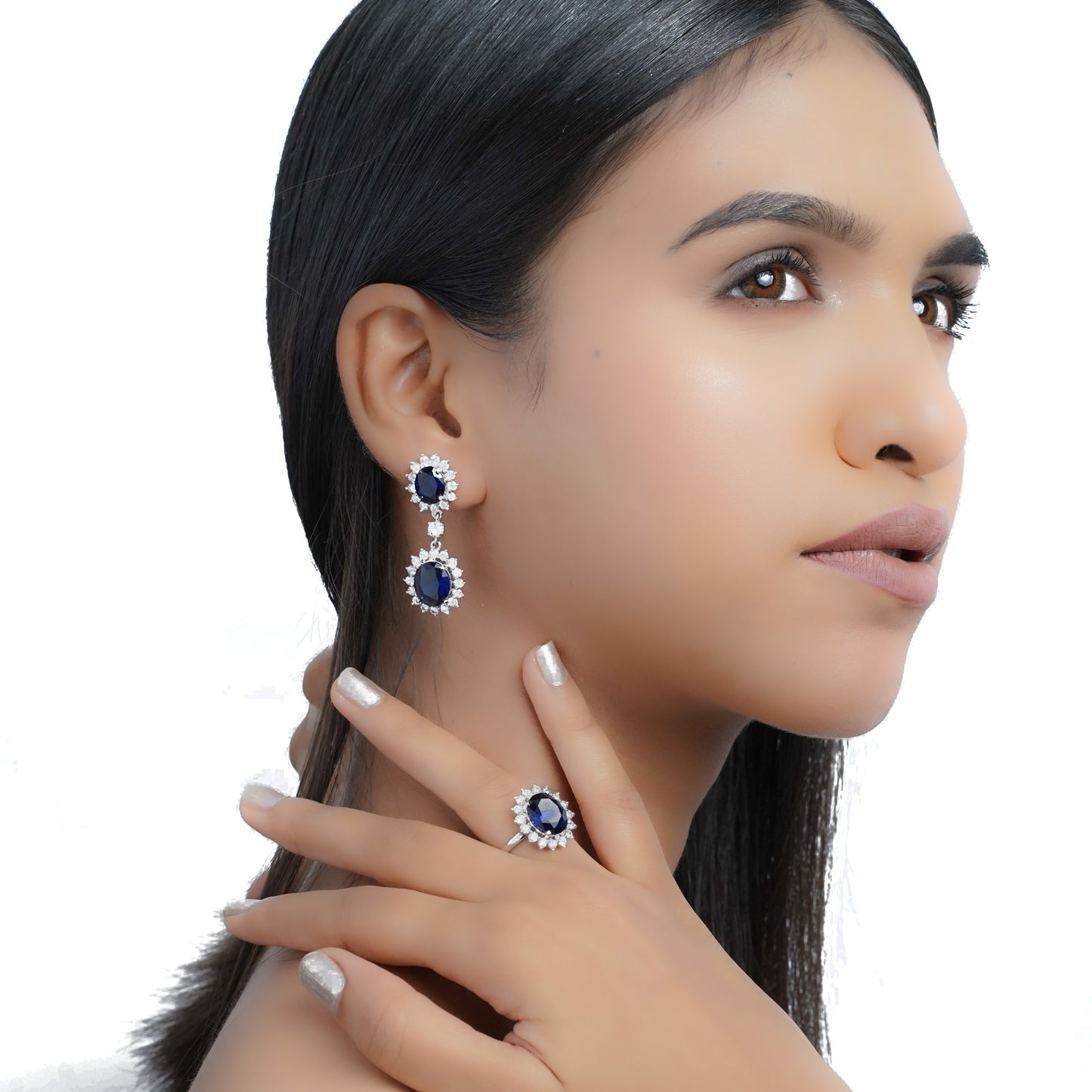 Model wearing a pair of  blue stone double drop earrings 