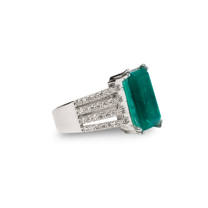 Diagonal view of green rectangle ring showing smooth finish and stone depth