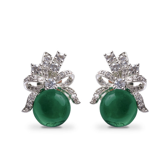 Front view of green stud earrings with bow design and white stones