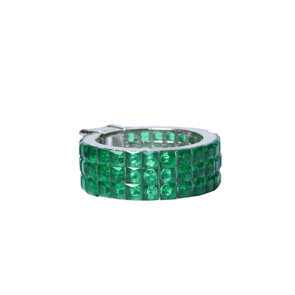 Front view of emerald green band ring with CZ