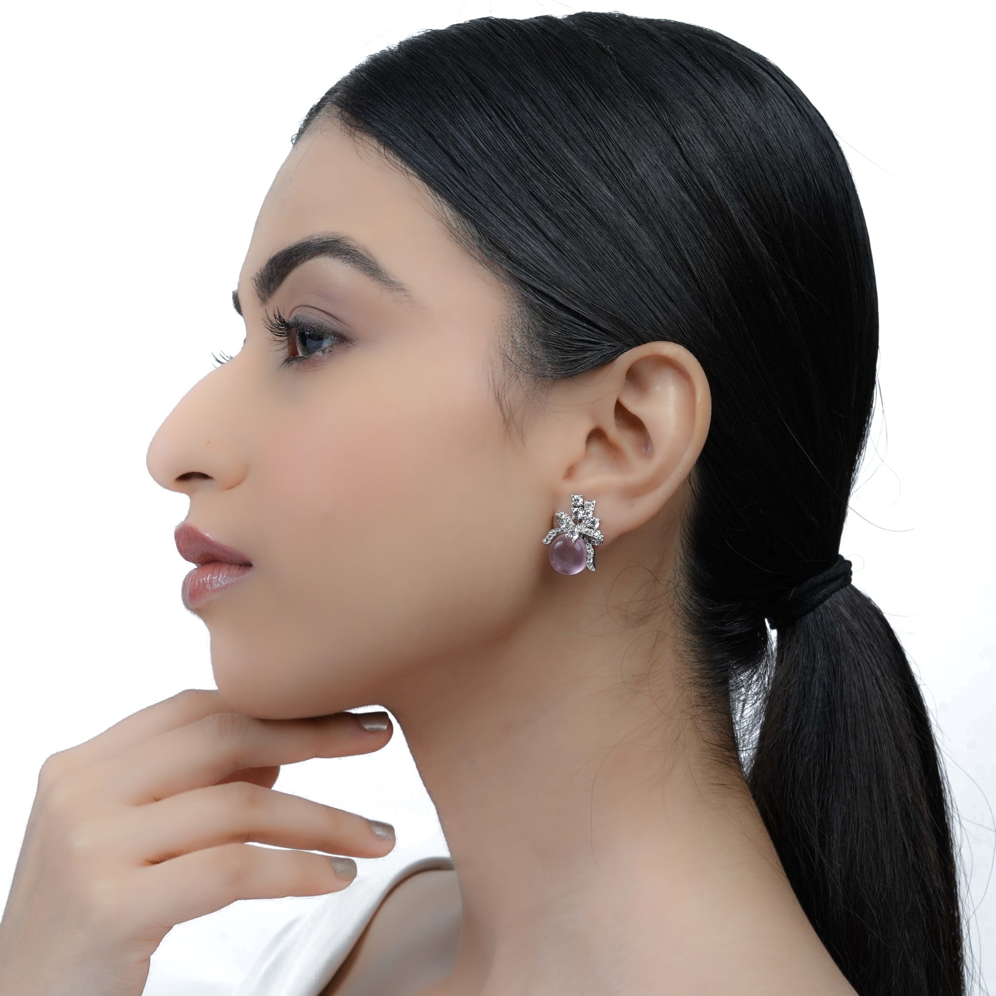 side view of model light purple stone bow design stud earrings for women elegant style

