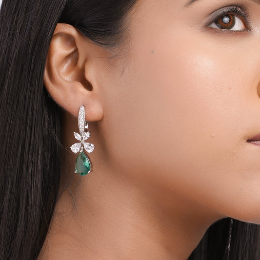 Model showing teal CZ hoop dangle earrings