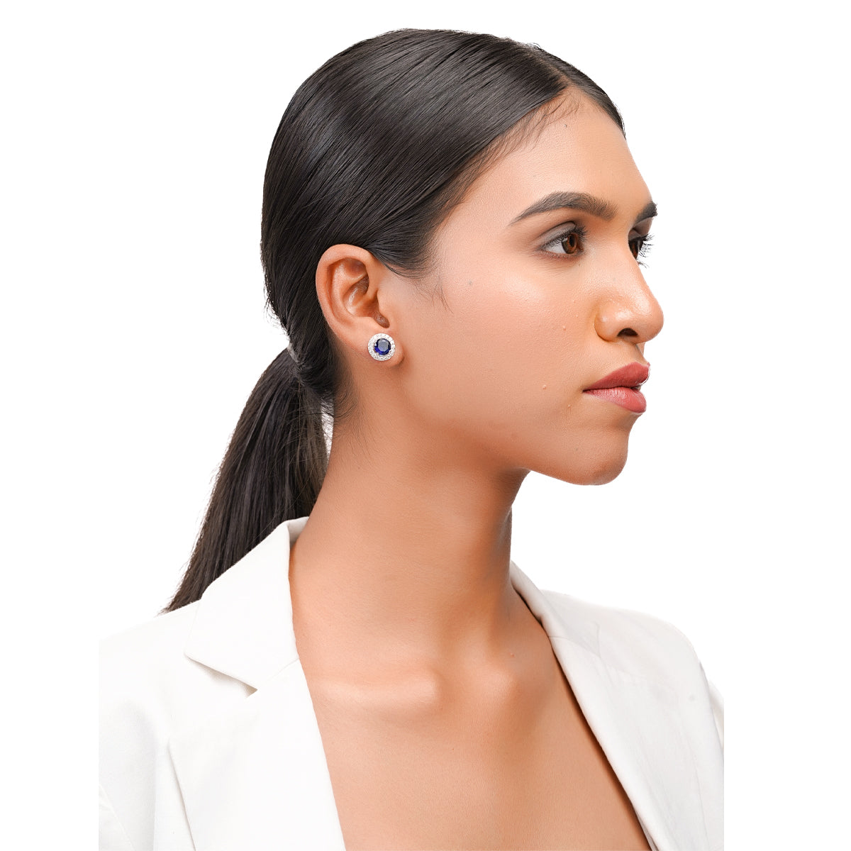 Model wearing both blue and white halo stud earrings in formal outfit