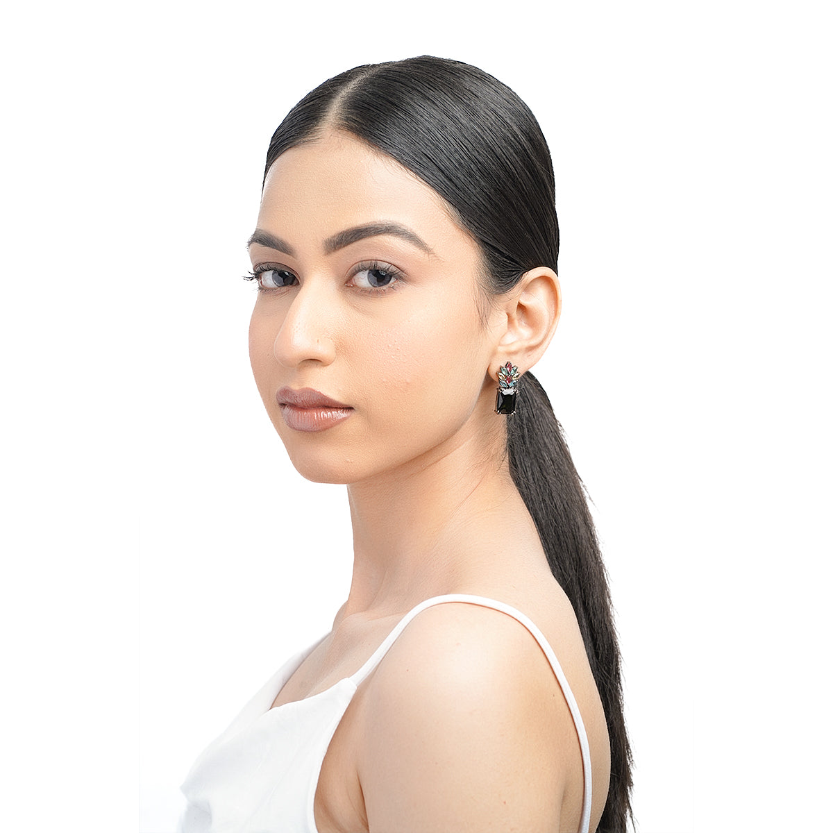 Model half-body view with black and colorful drop earrings