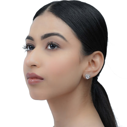 side profile of a model wearing a heart-shaped earrings
