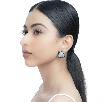 model wearing black frame grey stone stud earrings 