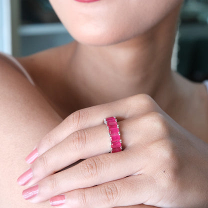 Close-up of a model wearing the Pink Baguette Eternity Ring, showcasing the sparkling pink baguette stones and elegant eternity band design.