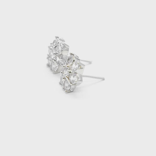 Close-up product video of Floral American Diamond Stud Earrings showcasing the sparkling floral design, American diamonds, and premium finish.