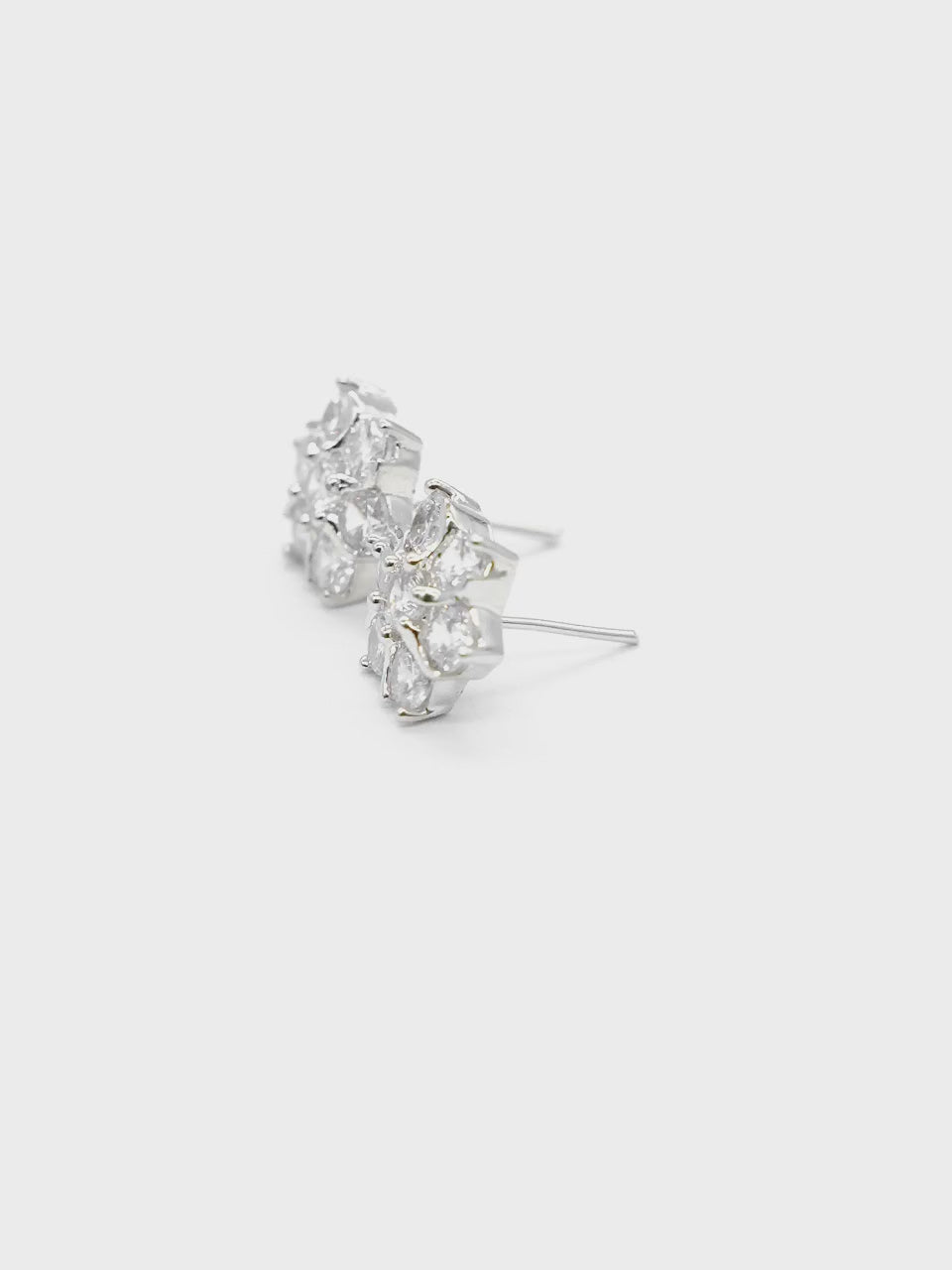 Close-up product video of Floral American Diamond Stud Earrings showcasing the sparkling floral design, American diamonds, and premium finish.