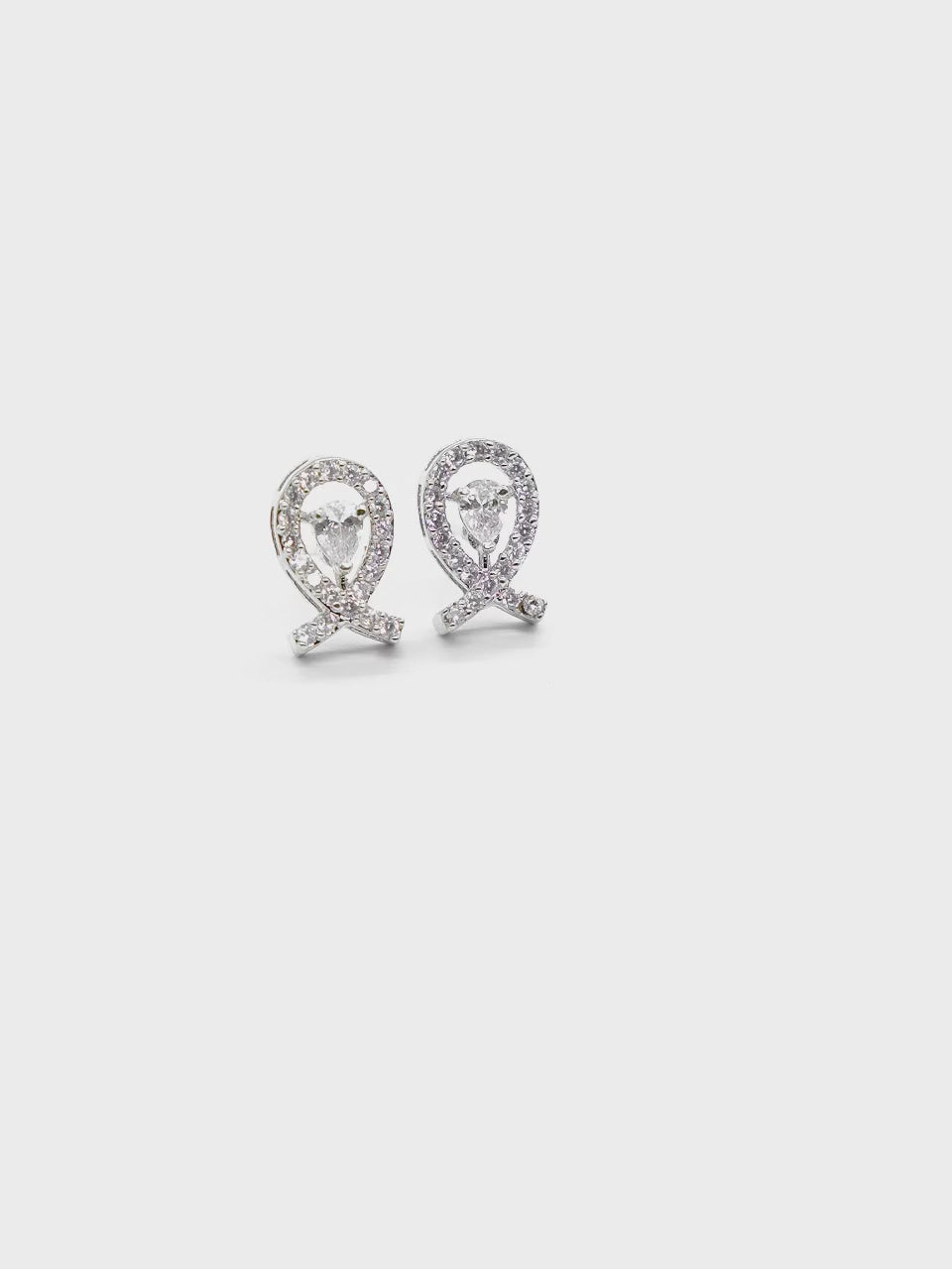 Close-up product video of Infinity American Diamond Earrings showcasing the elegant infinity design, sparkling American diamonds, and premium craftsmanship.