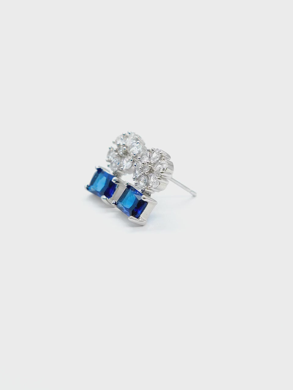 Close-up product video of Blue American Diamond Drop Earrings showcasing the vibrant blue stones, sparkling American diamonds, and premium craftsmanship.