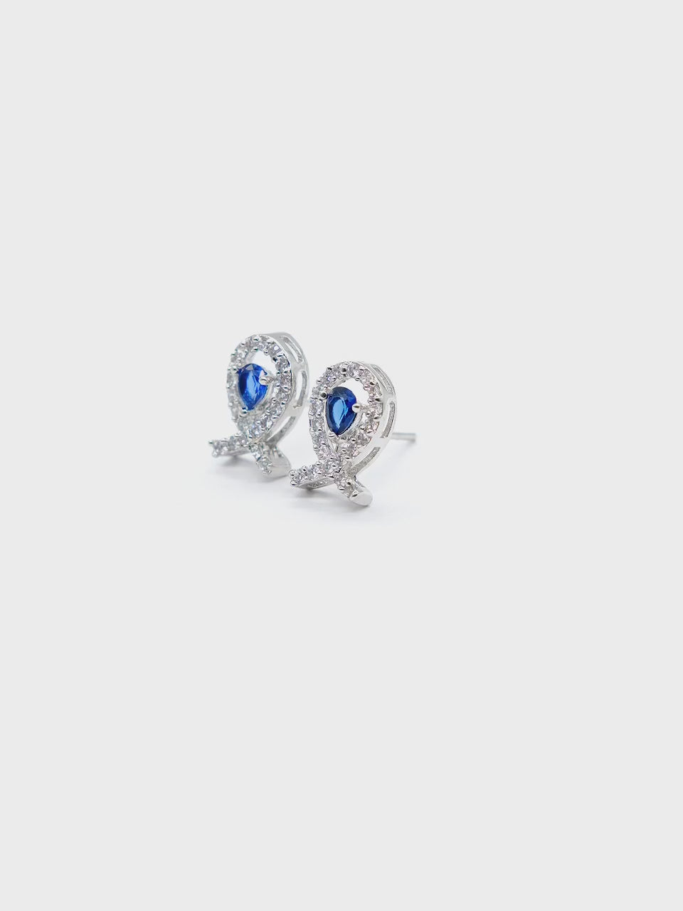Close-up product video of Blue Teardrop American Diamond Earrings showcasing the blue teardrop stones, sparkling American diamonds, and premium craftsmanship.