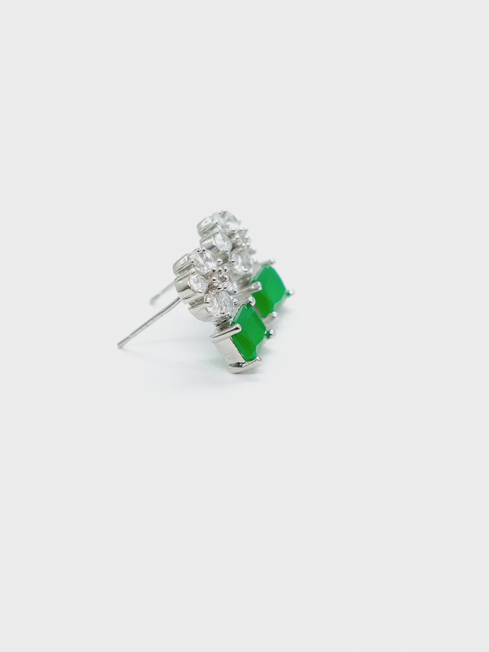 Close-up product video of Green American Diamond Drop Earrings showcasing the vibrant green stones, sparkling American diamonds, and premium craftsmanship.