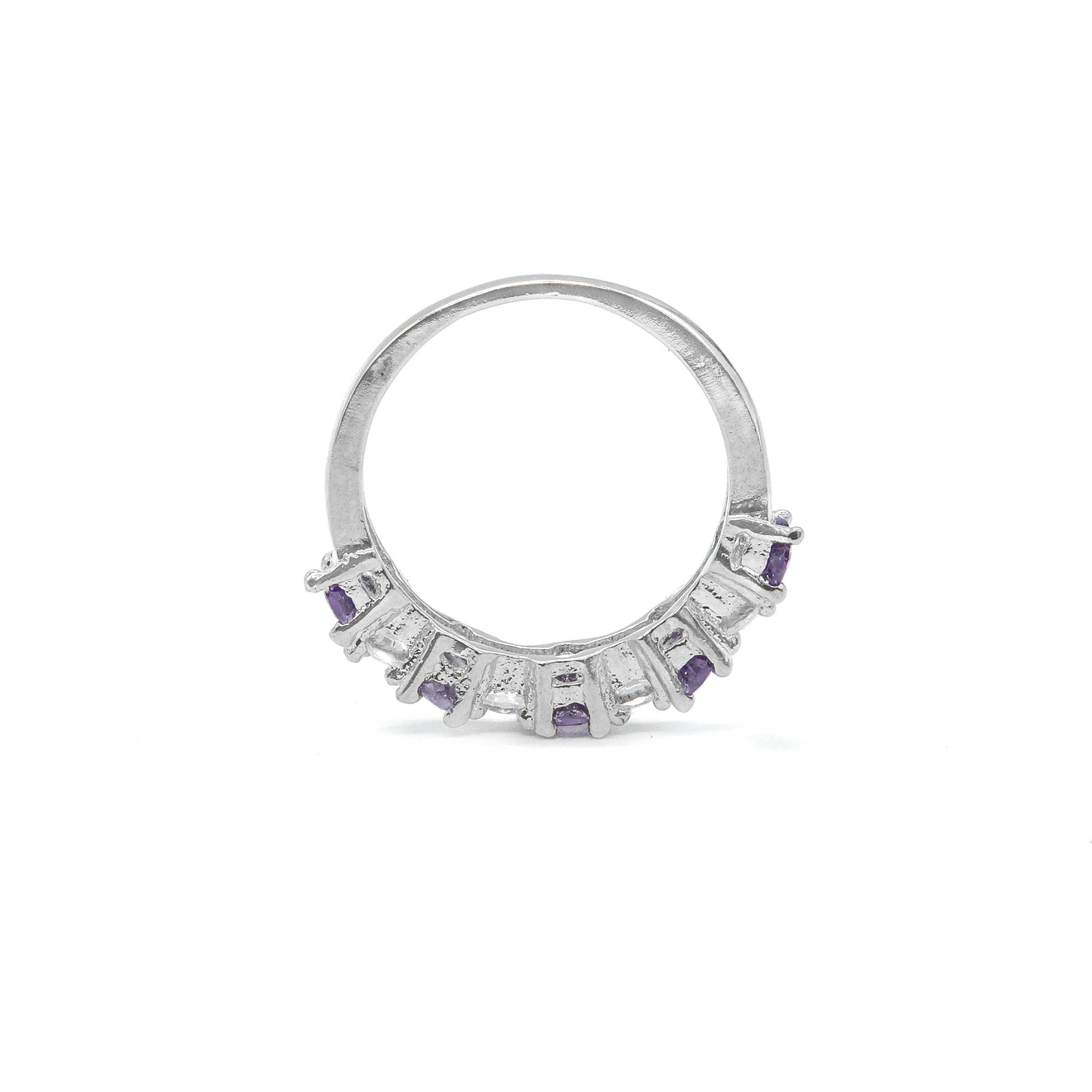 A silver ring featuring a semi-circular band adorned with small rectangular purple gemstones and clear stones, shown on a plain white background.